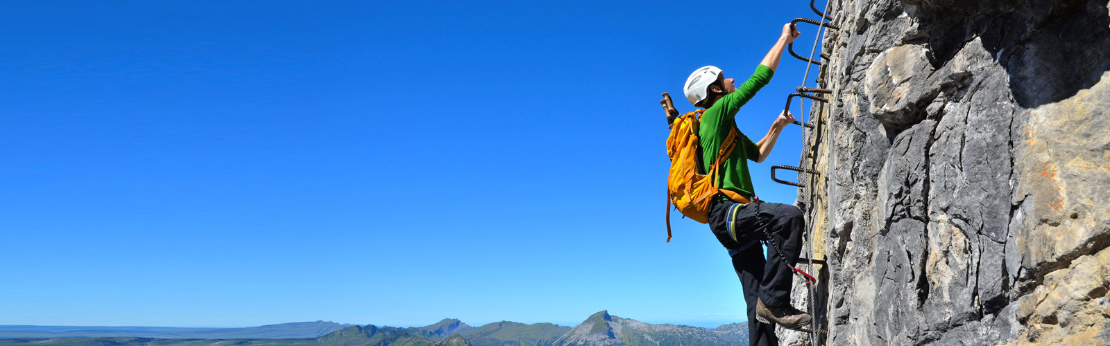 Alpiniste au sommet – accompagner votre croissance